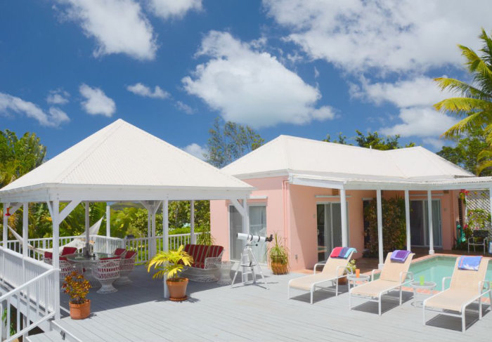 The hammock deck, living and dining gazebo, main deck, and poolside bedrooms